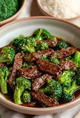 Beef and Broccoli stir-fry served in a bowl with rice