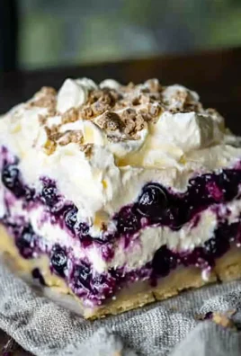 Delicious blueberry cheesecake lasagna dessert with creamy layers and blueberries