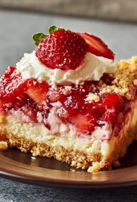 Easter strawberry cheesecake dump cake topped with fresh strawberries and whipped cream
