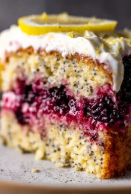 Gluten Free Lemon Poppy Seed Blackberry Cake topped with fresh blackberries