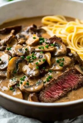 Delicious plate of Gordon Ramsay's Beef Stroganoff with creamy sauce and mushrooms