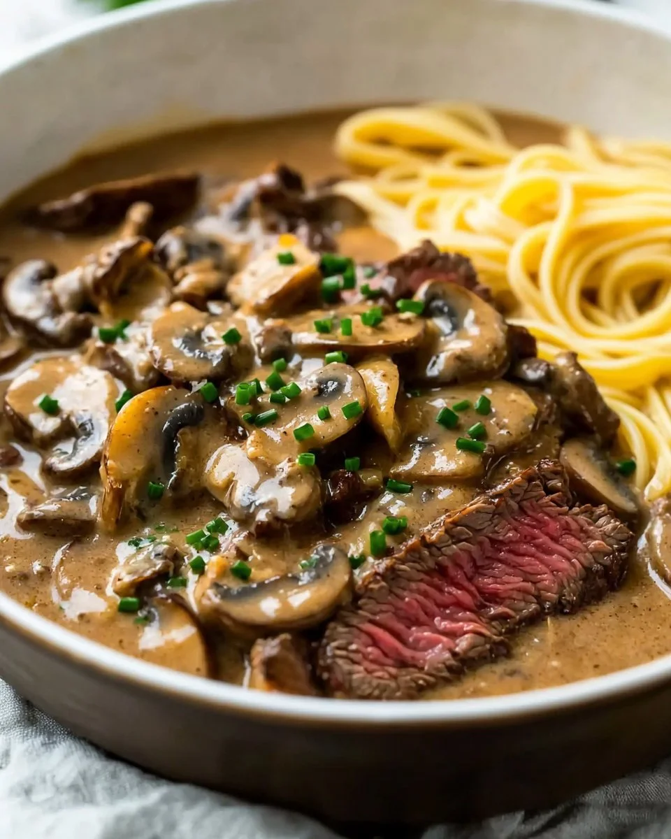 Delicious plate of Gordon Ramsay's Beef Stroganoff with creamy sauce and mushrooms