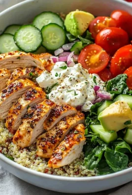 Delicious Greek Chicken Bowl with veggies and herbs