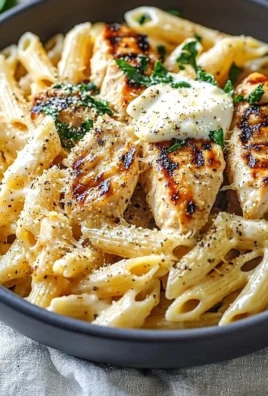 High protein Garlic Parmesan Pasta Bowl topped with herbs and cheese