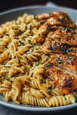Honey Garlic Chicken Pasta served on a plate with fresh herbs