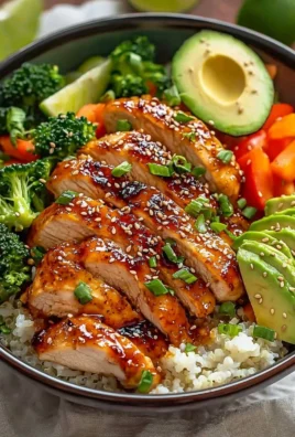 Hot honey chicken bowl with rice and vegetables, a sweet and spicy dinner recipe
