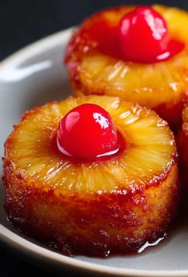 Delicious individual mini pineapple upside down cakes on a plate