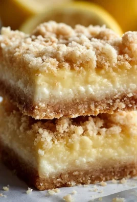 Lemon Crumb Bars with a buttery crumb topping and lemon filling on a plate