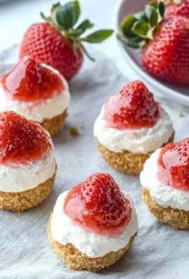 No Bake Strawberry Cheesecake Bites on a decorative plate