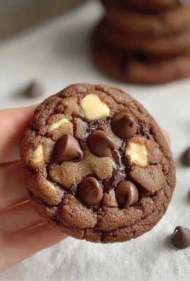 Single serve double chocolate chip cookie freshly baked on a plate.
