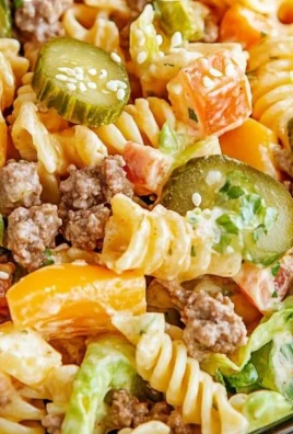 Big Mac Pasta Salad with hamburger meat, pasta, and special sauce in a bowl