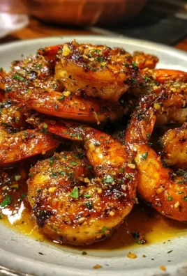 Cajun Hot Honey Shrimp served on a plate with garnishes.