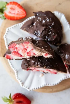 Delicious chocolate covered strawberry yogurt bites on a plate