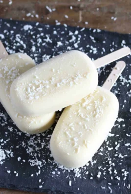Delicious Coconut Mango Popsicles served on a sunny day