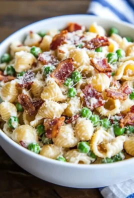 Delicious creamy pasta salad with vegetables served in a bowl