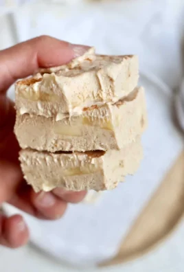 Creamy peanut butter banana frozen yogurt bars on a white plate