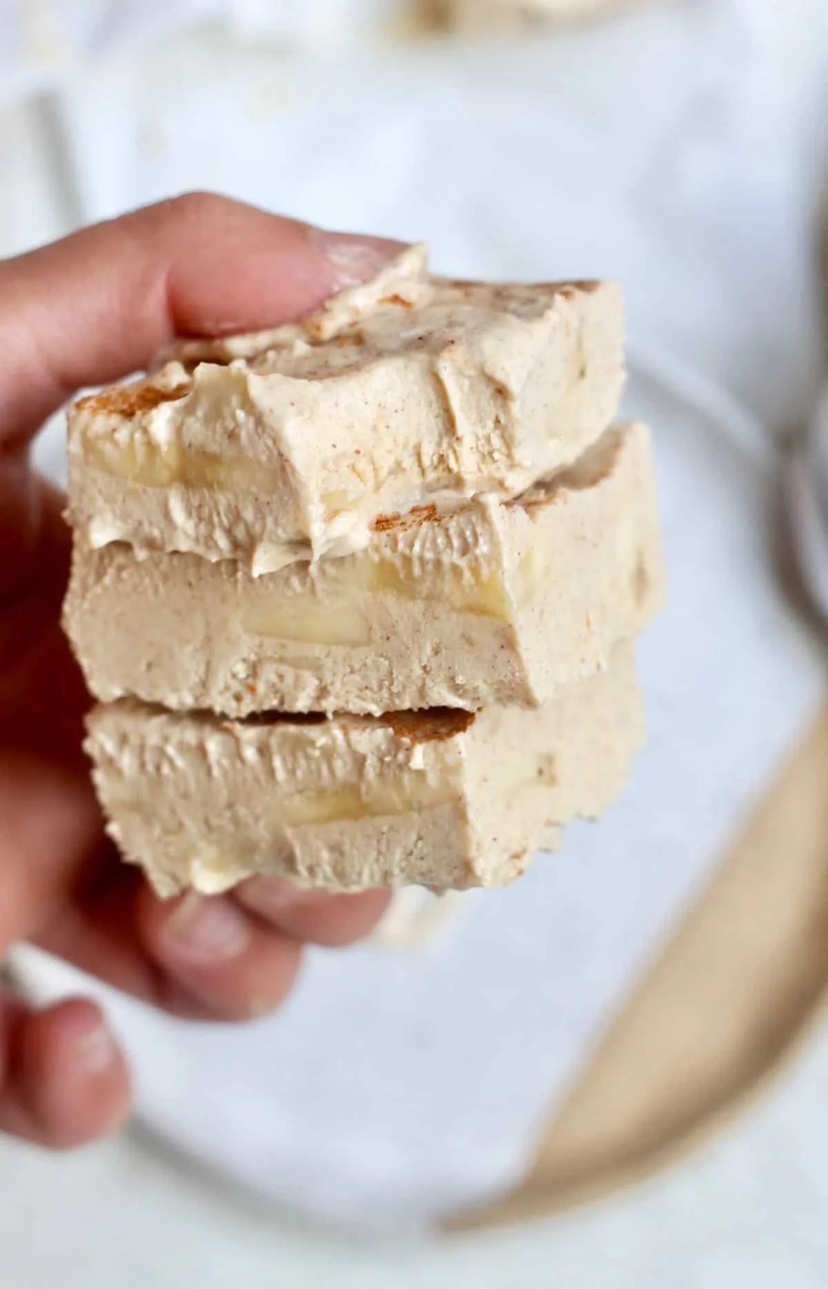 Creamy peanut butter banana frozen yogurt bars on a white plate