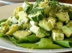 Cucumber avocado salad with fresh ingredients in a bowl