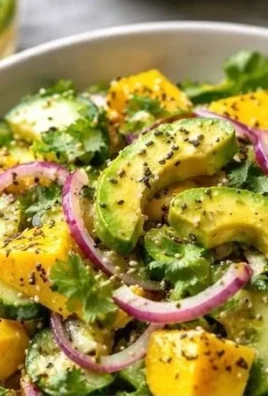 Fresh Cucumber Mango Avocado Salad served in a bowl