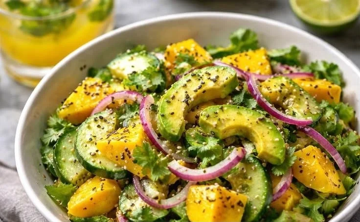 Fresh Cucumber Mango Avocado Salad served in a bowl