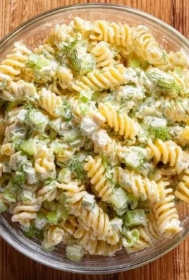 Delicious Dill Pickle Pasta Salad in a bowl with fresh ingredients