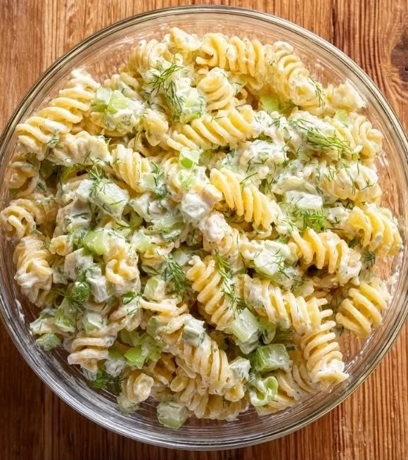 Delicious Dill Pickle Pasta Salad in a bowl with fresh ingredients