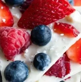 Delicious frozen yogurt bark topped with fresh berries