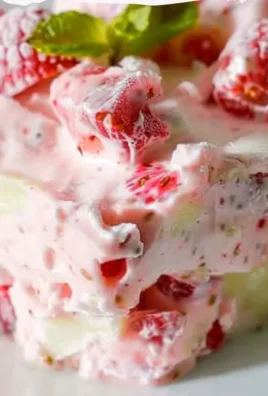 Delicious and colorful frozen fruit salad with mixed berries and tropical fruits