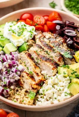 Delicious Greek Chicken Quinoa Bowl with fresh vegetables and feta cheese