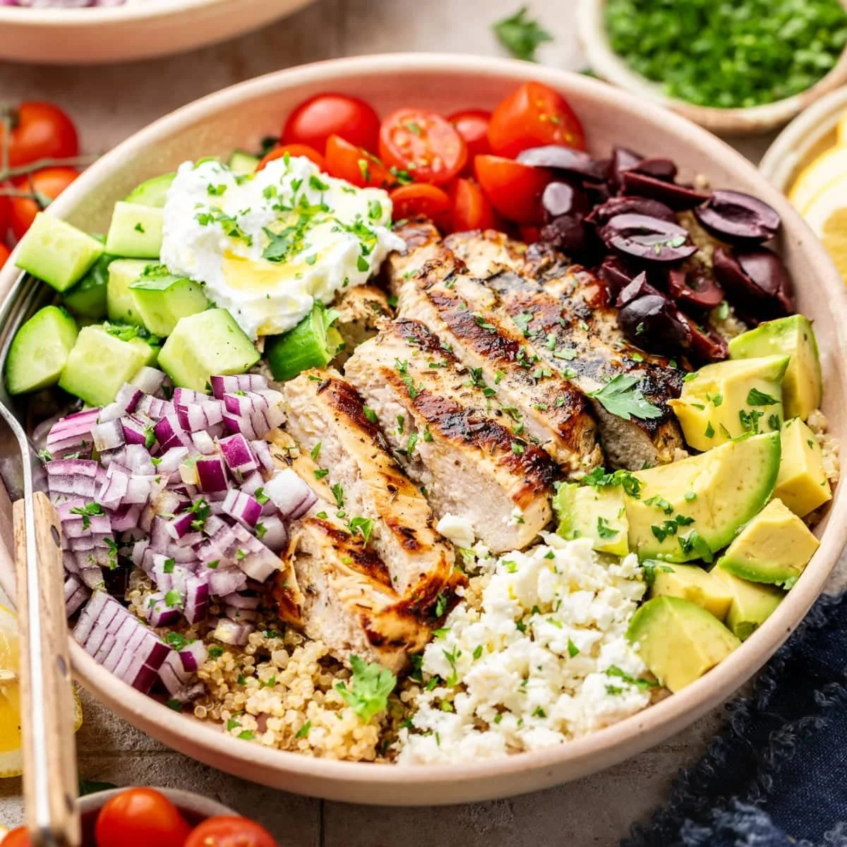 Delicious Greek Chicken Quinoa Bowl with fresh vegetables and feta cheese