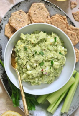 Herby avocado egg salad served in a bowl, ready for a quick and healthy meal.