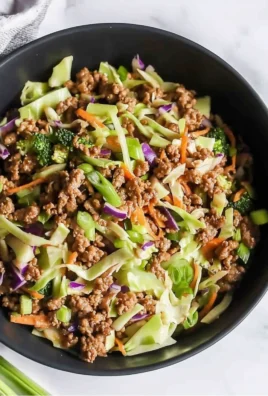 High Protein Egg Roll In A Bowl with colorful vegetables and toppings