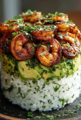 Honey Lime Shrimp and Avocado Rice Stack with colorful ingredients