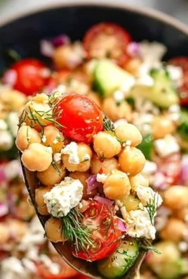 Delicious Mediterranean Chickpea Salad served in a bowl with vibrant vegetables.