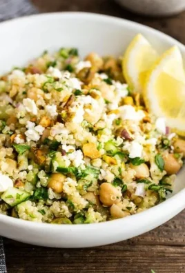 A colorful bowl of Jennifer Aniston Salad featuring fresh vegetables and quinoa.