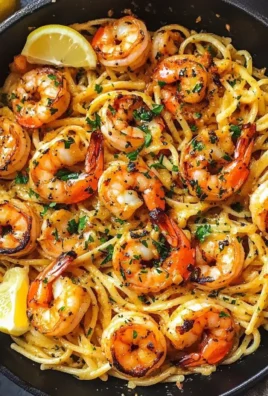 Lemon Garlic Butter Shrimp Pasta served in a bowl, garnished with parsley
