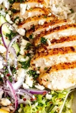 Delicious Lemon Herb Greek Chicken Bowl with fresh vegetables and herbs
