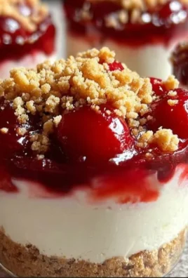 Delicious no-bake cheesecake parfaits layered with creamy filling and fresh berries.