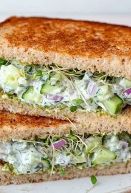 Quick cucumber salad sandwiches featuring fresh cucumbers and herbs on bread