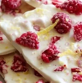 Raspberry-Lemon Greek frozen yogurt bark on a marble countertop