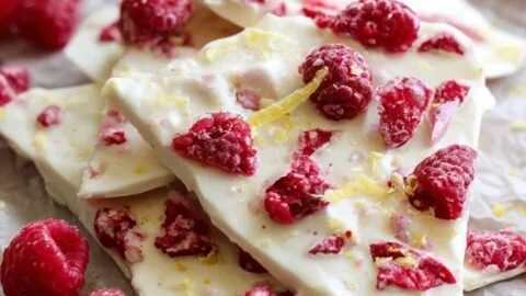 Raspberry-Lemon Greek frozen yogurt bark on a marble countertop