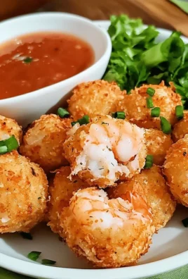 A plate of crispy golden shrimp balls served with dipping sauce.