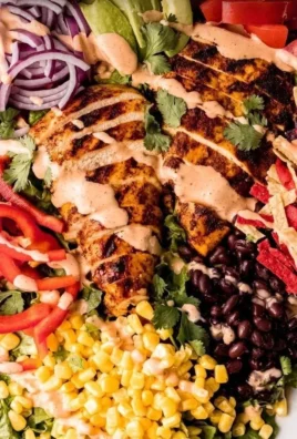 Bowl of Southwest Avocado Chicken Salad topped with colorful ingredients