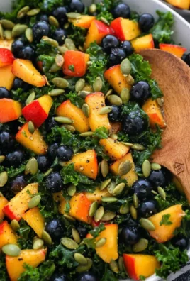 Delicious Summer Kale Salad with vibrant vegetables and dressing