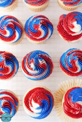 Colorful 4th of July cupcakes decorated with red, white, and blue frosting.