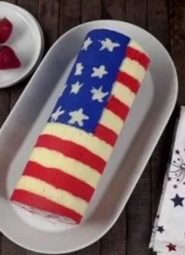 American Flag Roll Cake - a festive dessert with red, white, and blue layers.