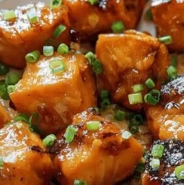 Crispy Bang Bang Salmon Bites served with a spicy sauce