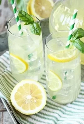 Glass of Basil Lemonade garnished with fresh basil leaves