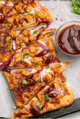 Delicious BBQ chicken flatbread pizza topped with fresh ingredients
