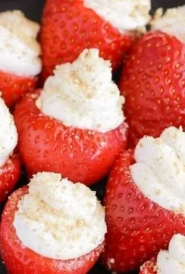 Delicious cheesecake stuffed strawberries on a serving platter